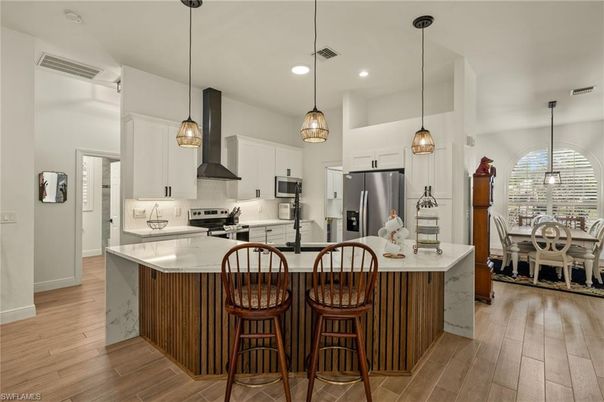 Dining room, Interior, Kitchen, Pendant Lights, Recessed Lighting, Stainless Steel Appliances, Wood Texture Flooring