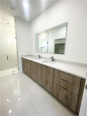 Bathroom, Dual Sink Vanities, Glass Shower, Interior, Marble, Recessed Lighting
