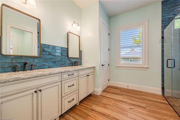 Bathroom, Dual Sink Vanities, Glass Shower, Interior, Wood Texture Flooring