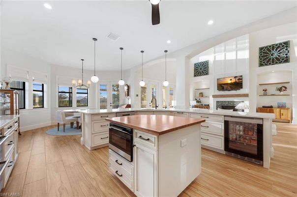 Dining room, Fireplace, Interior, Kitchen, Pendant Lights, Recessed Lighting, Wood Texture Flooring
