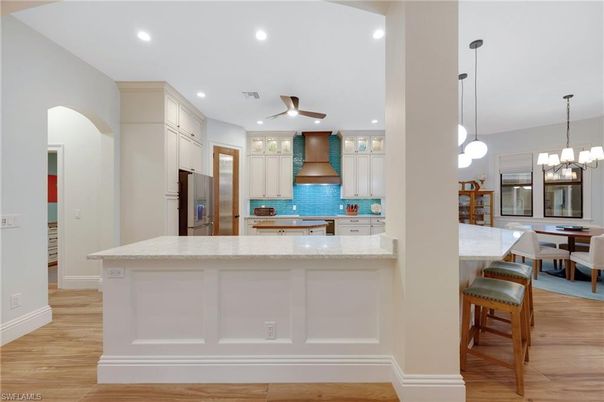 Chandelier, Dining room, Interior, Kitchen, Pendant Lights, Recessed Lighting, Stainless Steel Appliances, Wood Texture Flooring