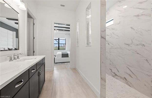 Bathroom, Bedroom, Dual Sink Vanities, Interior, Marble, Marble Walls, Wood Texture Flooring