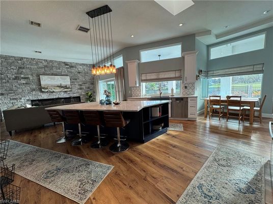Dining room, Fireplace, Interior, Kitchen, Pendant Lights, Recessed Lighting, Stone Walls, Wood Texture Flooring