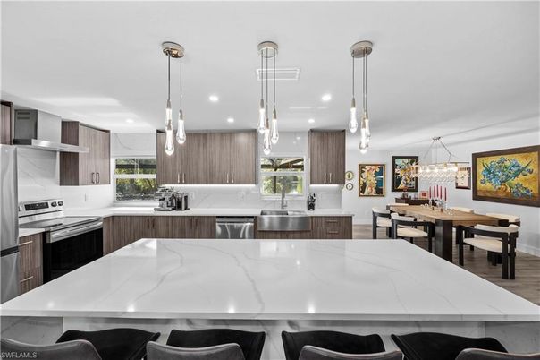 Dining room, Interior, Kitchen, Pendant Lights, Recessed Lighting, Stainless Steel Appliances, Wood Texture Flooring