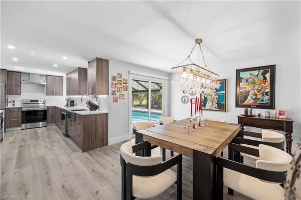 Chandelier, Dining room, Interior, Kitchen, Recessed Lighting, Stainless Steel Appliances, Wood Texture Flooring