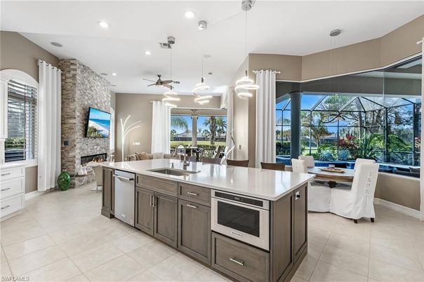 Dining room, Fireplace, Interior, Kitchen, Pendant Lights, Recessed Lighting, Stainless Steel Appliances, Stone Walls