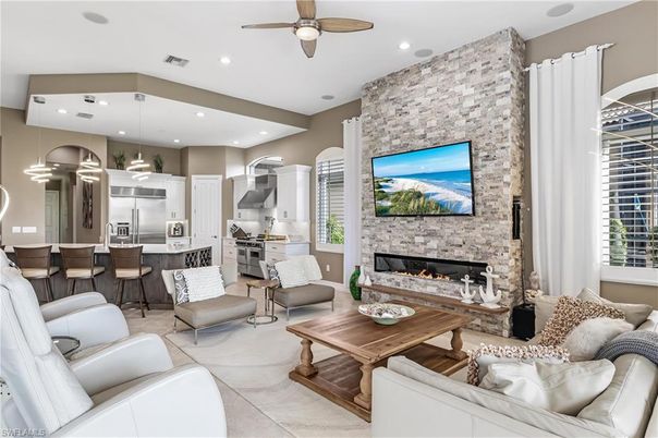 Fireplace, Interior, Kitchen, Living room, Pendant Lights, Recessed Lighting, Stainless Steel Appliances, Stone Walls