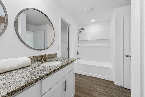 Bathroom, Dual Sink Vanities, Interior, Recessed Lighting, Wood Texture Flooring