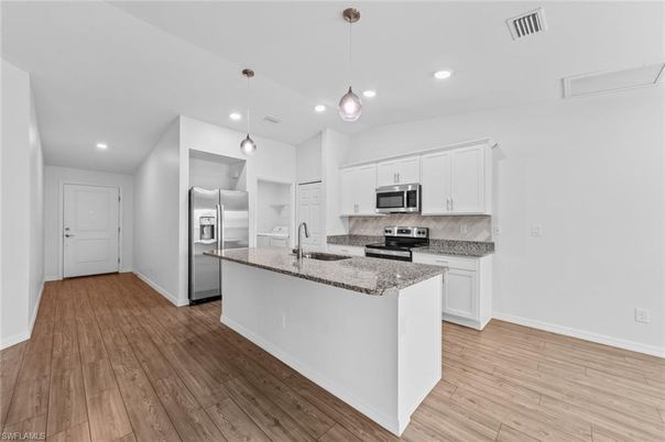 Interior, Kitchen, Pendant Lights, Recessed Lighting, Stainless Steel Appliances, Wood Texture Flooring