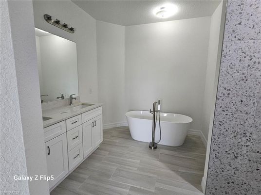 Bathroom, Dual Sink Vanities, Free Standing Baths, Interior, Wood Texture Flooring