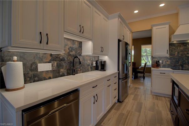 Dining room, Interior, Kitchen, Recessed Lighting, Stainless Steel Appliances, Wood Texture Flooring