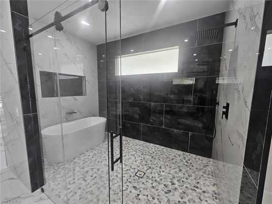Bathroom, Free Standing Baths, Glass Shower, Interior, Marble Walls, Recessed Lighting