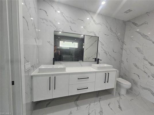 Bathroom, Dual Sink Vanities, Interior, Marble, Marble Walls, Recessed Lighting