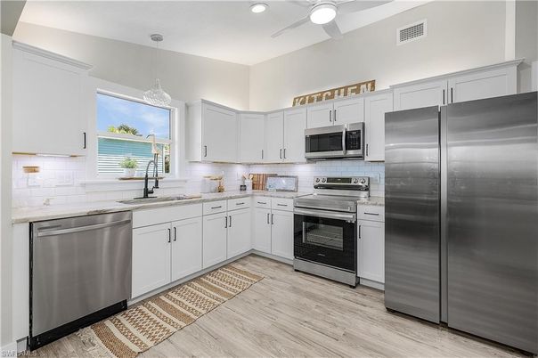 Interior, Kitchen, Pendant Lights, Recessed Lighting, Stainless Steel Appliances, Wood Texture Flooring
