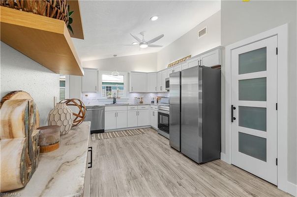 Interior, Kitchen, Recessed Lighting, Stainless Steel Appliances, Wood Texture Flooring