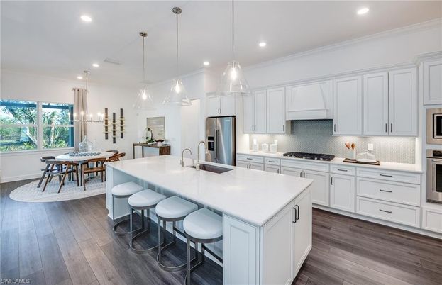Dining room, Interior, Kitchen, Pendant Lights, Recessed Lighting, Stainless Steel Appliances, Wood Texture Flooring