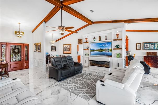 Chandelier, Fireplace, Interior, Living room, Marble, Pendant Lights, Wooden Beams