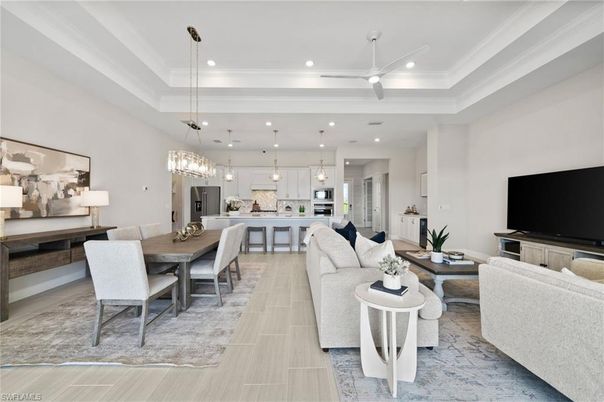 Chandelier, Dining room, Interior, Kitchen, Living room, Pendant Lights, Recessed Lighting, Stainless Steel Appliances, Wood Texture Flooring