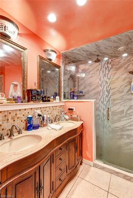 Bathroom, Dual Sink Vanities, Glass Shower, Interior, Marble Walls, Recessed Lighting