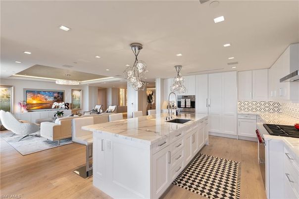Chandelier, Dining room, Interior, Kitchen, Living room, Pendant Lights, Recessed Lighting, Stainless Steel Appliances, Wood Texture Flooring