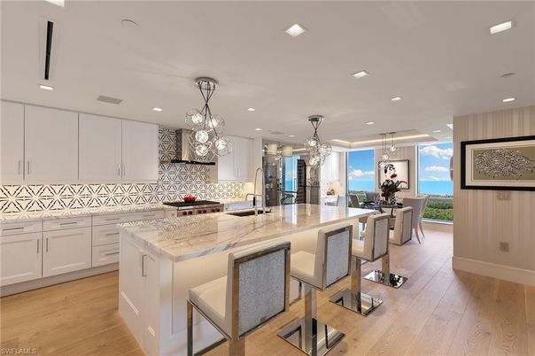 Dining room, Interior, Kitchen, Pendant Lights, Recessed Lighting, Stainless Steel Appliances, Wood Texture Flooring