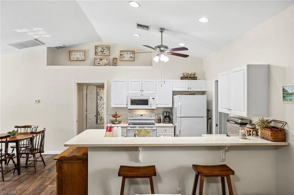 Dining room, Interior, Kitchen, Recessed Lighting, Stainless Steel Appliances, Wood Texture Flooring