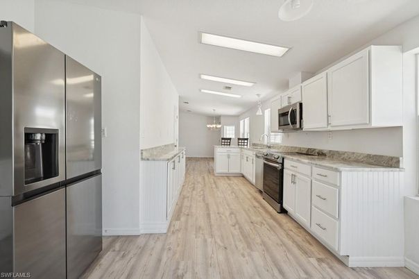 Chandelier, Interior, Kitchen, Recessed Lighting, Stainless Steel Appliances, Wood Texture Flooring