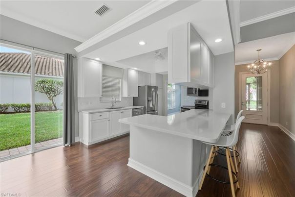 Chandelier, Interior, Kitchen, Recessed Lighting, Stainless Steel Appliances, Wood Texture Flooring