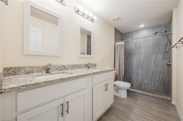 Bathroom, Dual Sink Vanities, Interior, Recessed Lighting, Wood Texture Flooring