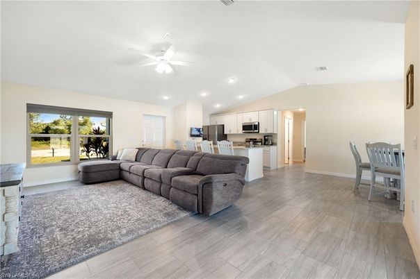Dining room, Interior, Kitchen, Living room, Recessed Lighting, Stainless Steel Appliances, Wood Texture Flooring
