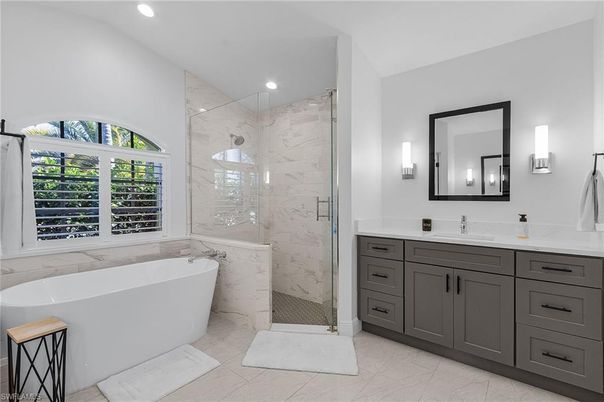Bathroom, Dual Sink Vanities, Free Standing Baths, Glass Shower, Interior, Marble, Marble Walls, Recessed Lighting
