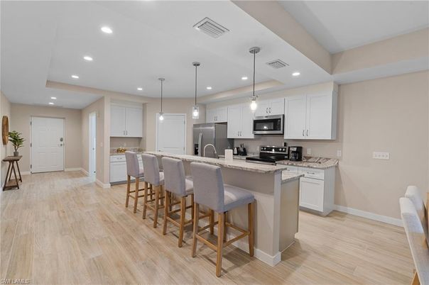 Interior, Kitchen, Pendant Lights, Recessed Lighting, Stainless Steel Appliances, Wood Texture Flooring
