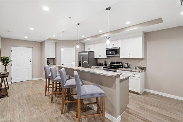 Interior, Kitchen, Pendant Lights, Recessed Lighting, Stainless Steel Appliances, Wood Texture Flooring