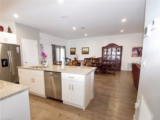 Dining room, Interior, Kitchen, Recessed Lighting, Stainless Steel Appliances, Wood Texture Flooring