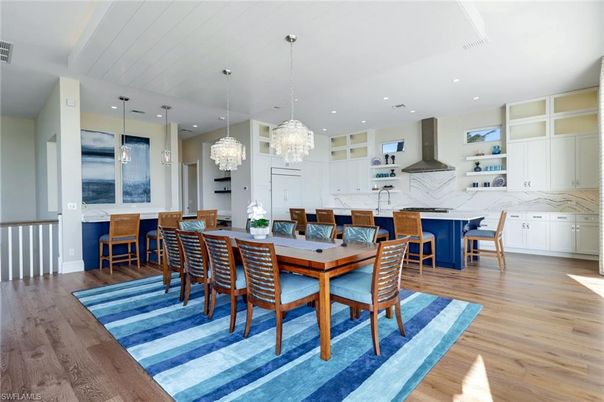 Chandelier, Dining room, Interior, Kitchen, Marble Walls, Pendant Lights, Recessed Lighting, Wood Texture Flooring