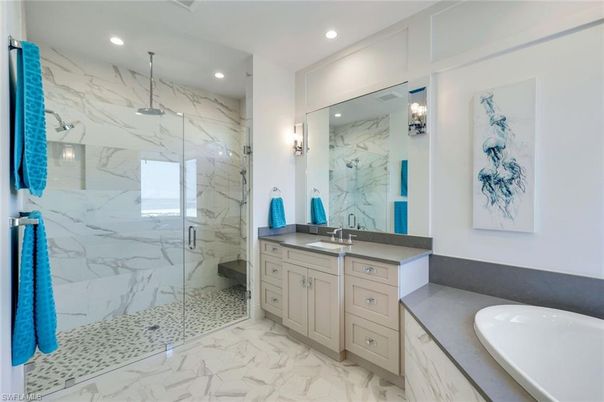 Bathroom, Dual Sink Vanities, Glass Shower, Interior, Marble, Marble Walls, Recessed Lighting