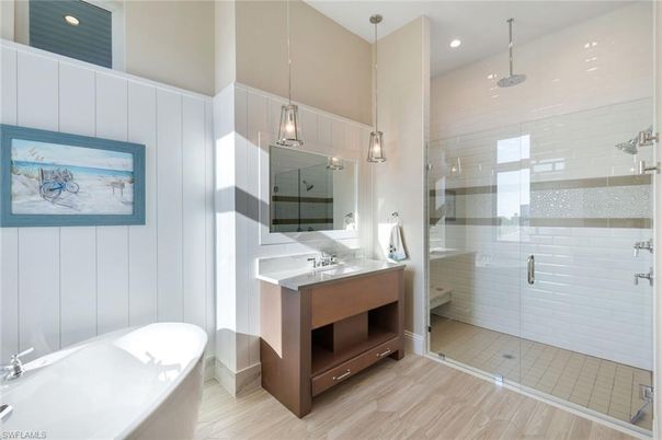 Bathroom, Free Standing Baths, Glass Shower, Interior, Pendant Lights, Recessed Lighting, Wood Texture Flooring