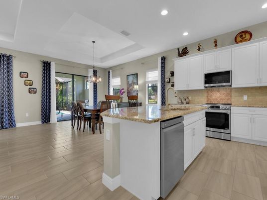 Chandelier, Dining room, Interior, Kitchen, Recessed Lighting, Stainless Steel Appliances, Wood Texture Flooring