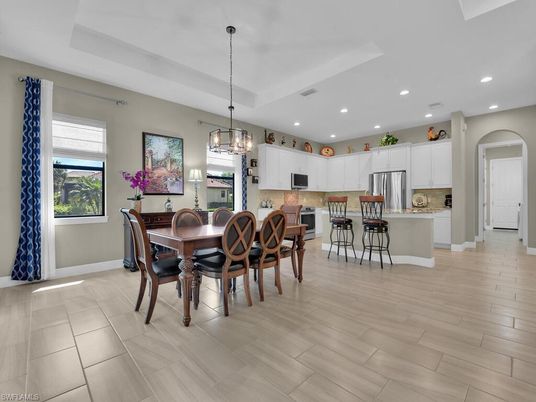 Chandelier, Dining room, Interior, Kitchen, Pendant Lights, Recessed Lighting, Stainless Steel Appliances, Wood Texture Flooring