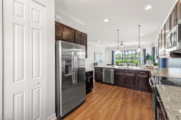 Interior, Kitchen, Pendant Lights, Recessed Lighting, Stainless Steel Appliances, Wood Texture Flooring