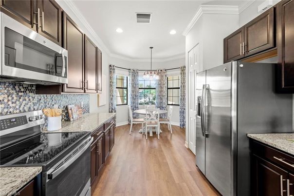 Dining room, Interior, Kitchen, Pendant Lights, Recessed Lighting, Stainless Steel Appliances, Wood Texture Flooring