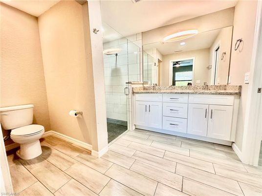 Bathroom, Dual Sink Vanities, Glass Shower, Interior, Wood Texture Flooring