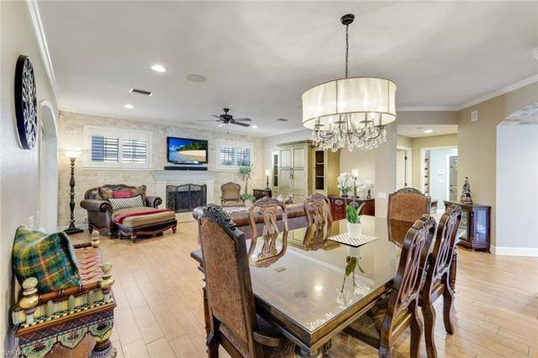Chandelier, Dining room, Fireplace, Interior, Living room, Recessed Lighting, Stone Walls, Wood Texture Flooring