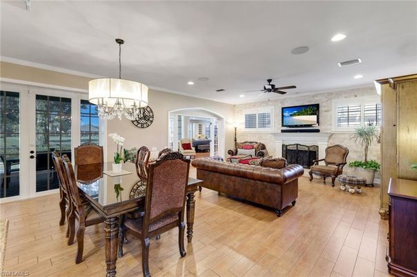 Chandelier, Dining room, Fireplace, Interior, Living room, Recessed Lighting, Wood Texture Flooring