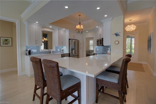 Chandelier, Dining room, Interior, Kitchen, Recessed Lighting, Stainless Steel Appliances, Wood Texture Flooring
