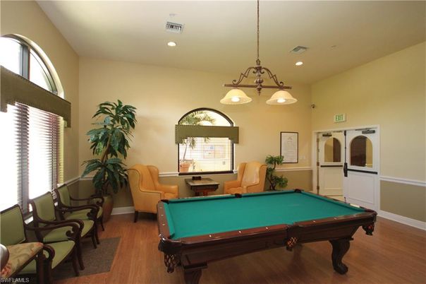 Billiard Table, Chandelier, Game Room, Interior, Pendant Lights, Recessed Lighting, Wood Texture Flooring