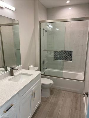 Bathroom, Glass Shower, Interior, Marble Walls, Recessed Lighting, Wood Texture Flooring
