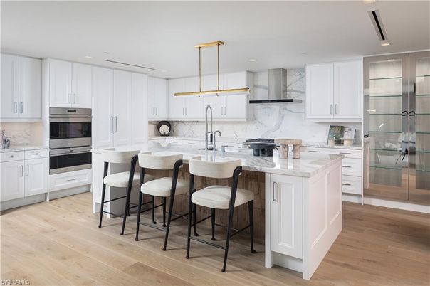 Interior, Kitchen, Marble Walls, Pendant Lights, Recessed Lighting, Stainless Steel Appliances, Wood Texture Flooring