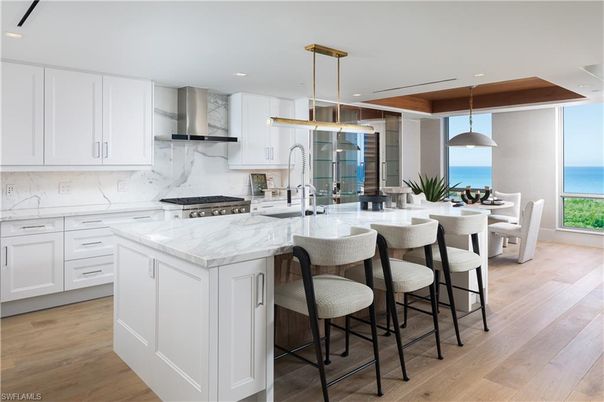 Dining room, Interior, Kitchen, Marble Walls, Pendant Lights, Recessed Lighting, Stainless Steel Appliances, Water, Wood Texture Flooring