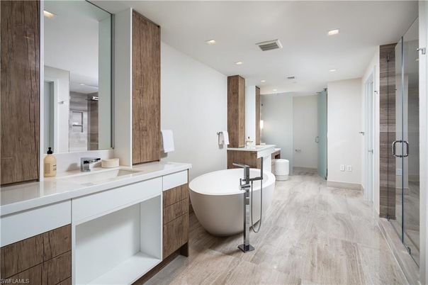 Bathroom, Dual Sink Vanities, Free Standing Baths, Glass Shower, Interior, Recessed Lighting, Wood Texture Flooring